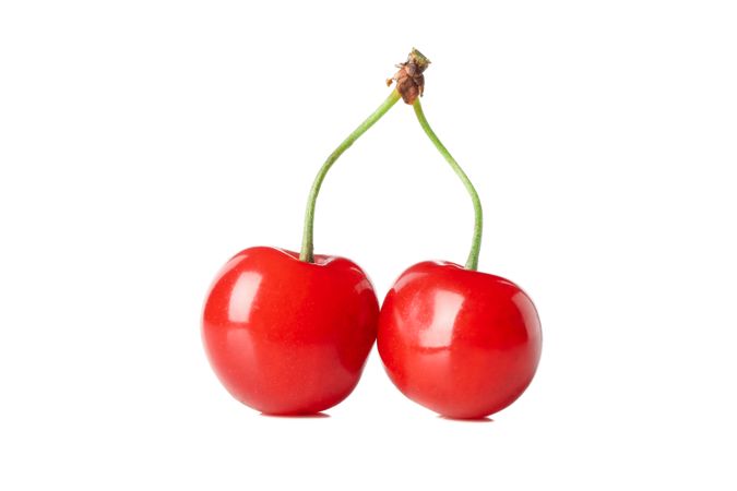 Fresh red cherry isolated on studio background