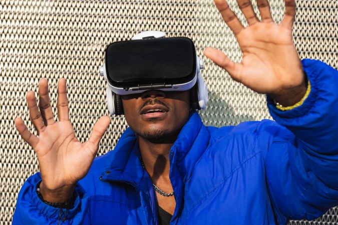 Black man experiencing virtual reality in city