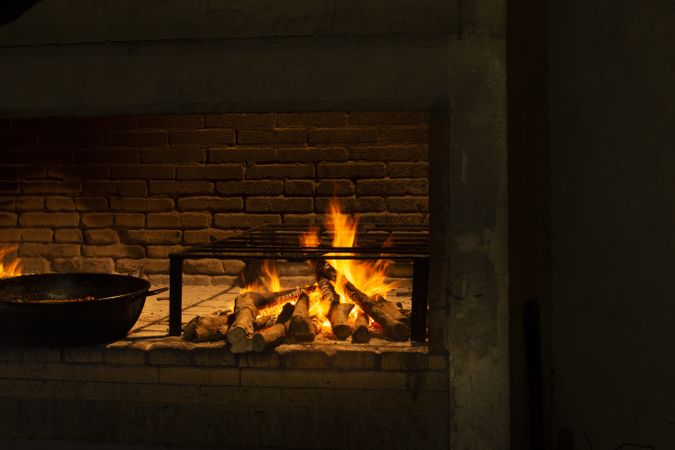 Fireplace with wood and cast iron pan