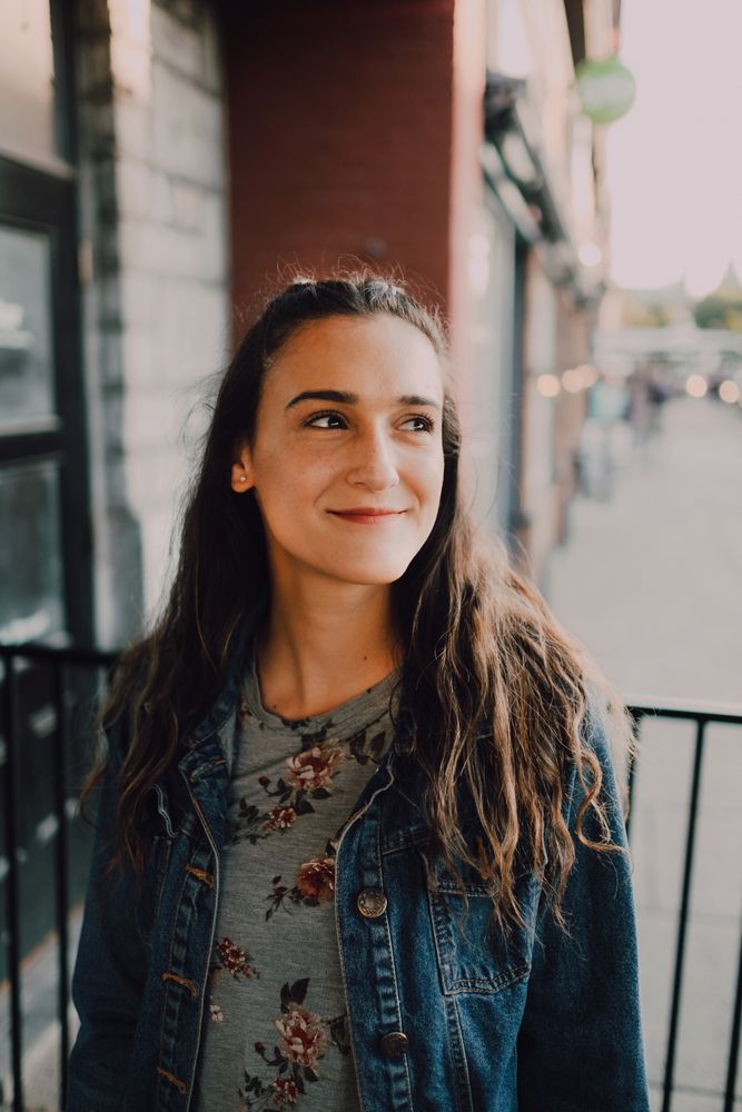 Smiling modern woman standing on street