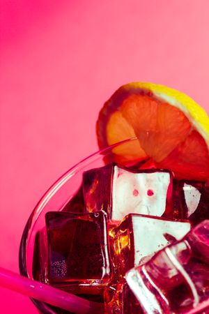 Drink in glass with ice and lemon