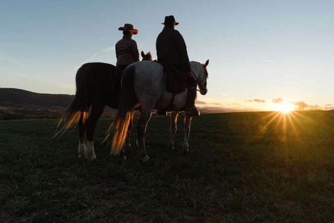 Man and woman riding horses