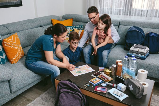 Mother explaining to her family the emergency assembly point