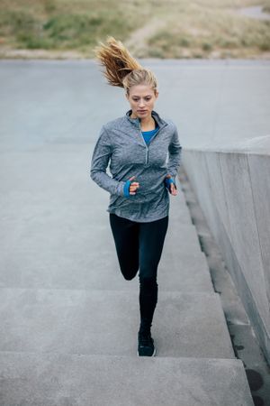 Fitness woman doing running exercise on stair