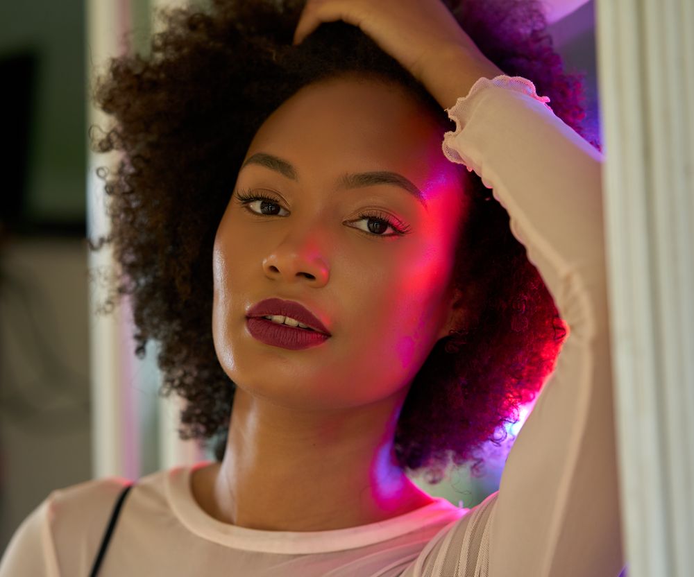 Woman with afro hair and red lipsticks
