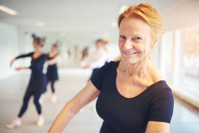 Portrait of smiling mature woman in dance studio