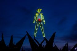 Art installation of neon man at "Burning Man,” Burning Man, Nevada E43KR4