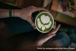 Woman with green match latte 5nDV8b