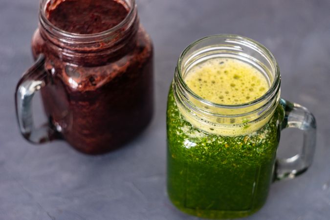 Top of purple and green smoothie on counter