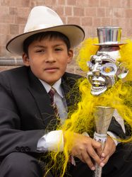 Peru - January, 02 2012: Schoolboy with fancy staff looking at camera