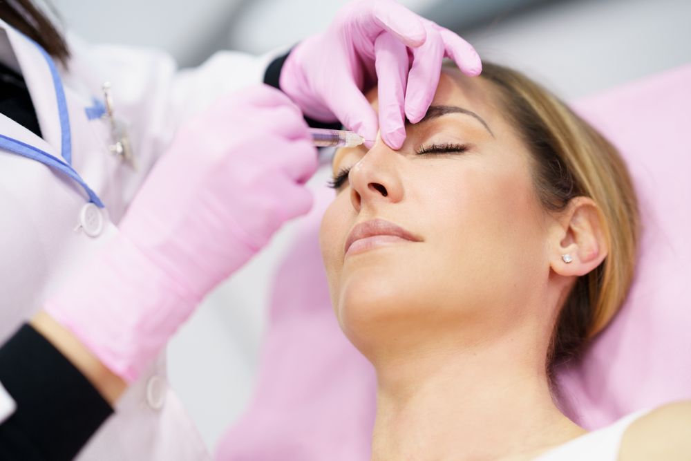 Woman having her upper nose injected
