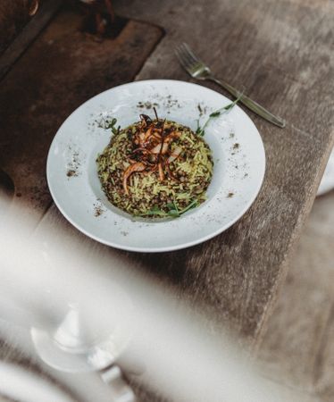 beans hummus in plate close to vegetables plateplate of delicious Mujaddara