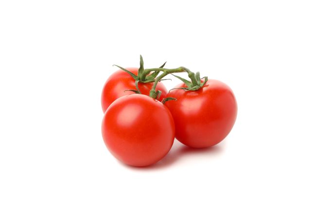 Fresh ripe tomatoes isolated on plain background