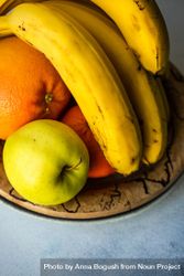 Bowl of fruit with oranges, apple and bananas 5lVmdm