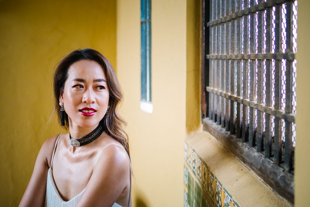 Young elegant Asian woman at a luxurious resort