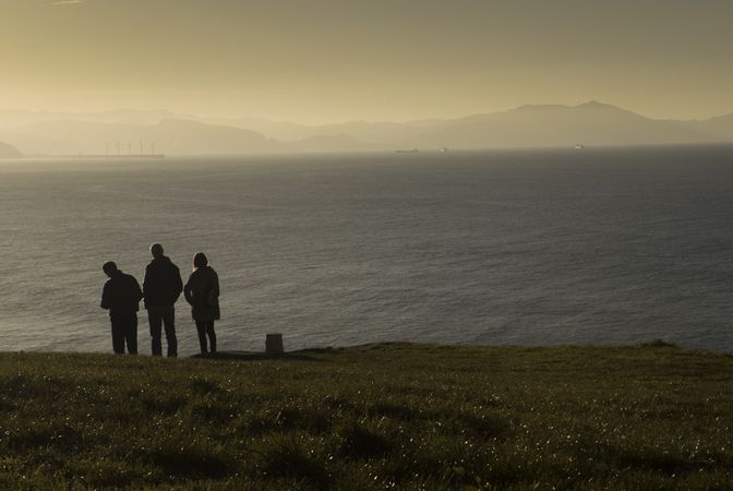 Tourists enjoying views at sea coast