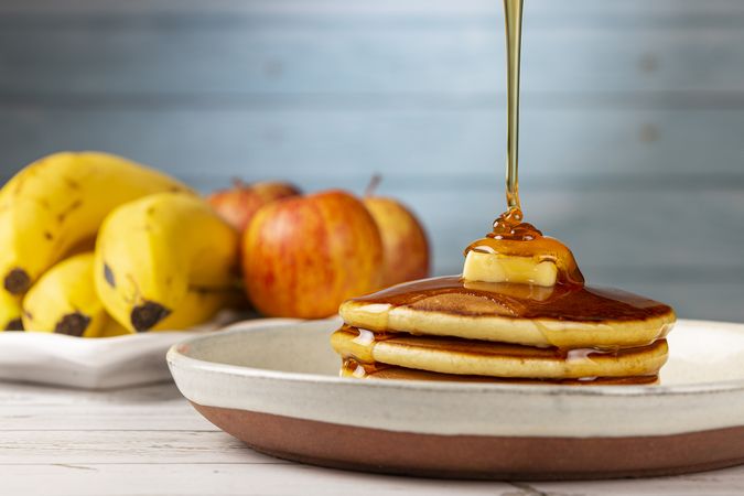 Delicious pancakes with butter and honey.