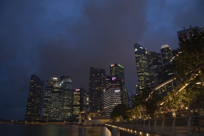 Singapore - October 23, 2019: Skyscrapers and office buildings with lights on near Fullerton Road