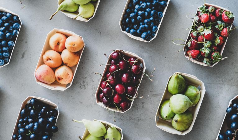 Diagonal rows of fresh fruit in eco-friendly boxed
