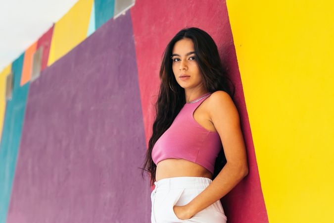 Portrait of a young latina woman, on a colorful background