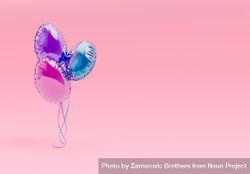 Creative Easter party with colorful balloons on pink background 0LPjP0