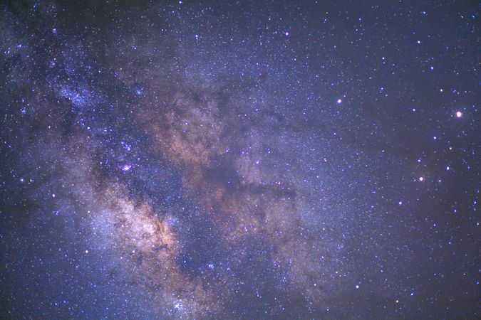 The center of milky way galaxy and space dust in the universe, Long exposure photograph, with grain.