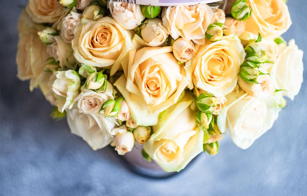 Pastel yellow floral card on grey counter