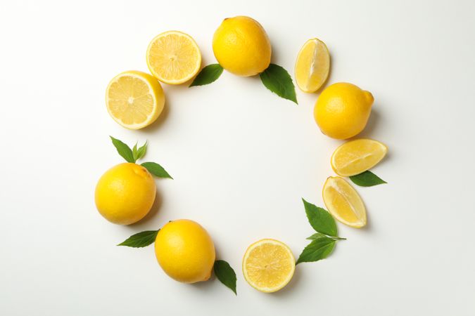 Flat lay with lemons on light background. Fresh fruit