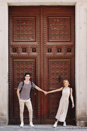 Happy couple having fun while walking in town