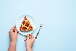 Woman serving a piece of pie