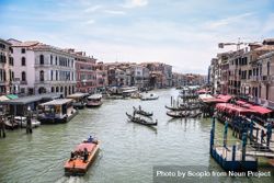 Gondolas in water canal in Metropolitan City of Venice, Italy 4BxvW0
