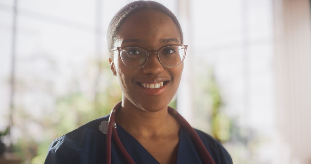 Portrait of a Black Female Medical Health Care Professional Posing for Camera, Smiling and Looking at Camera.