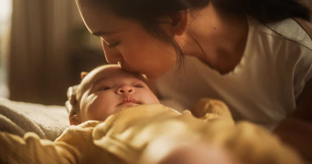 Woman Expressing her Motherly Love to her Infant, Thankful for the Blessing of Having Beautiful Children.