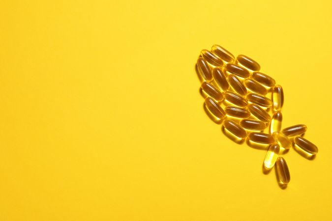 Omega pills in the shape of a fish