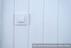 Light switch on wood pannelled wall 426Rym
