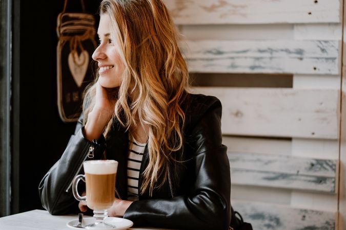 Woman drinking coffee from a glass