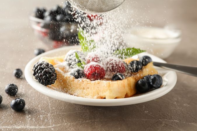Composition of breakfast with belgian waffle, space for text