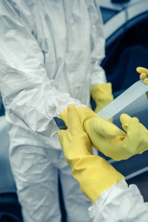 Young people putting on protective gloves