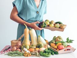 Crop female with fresh vegetables