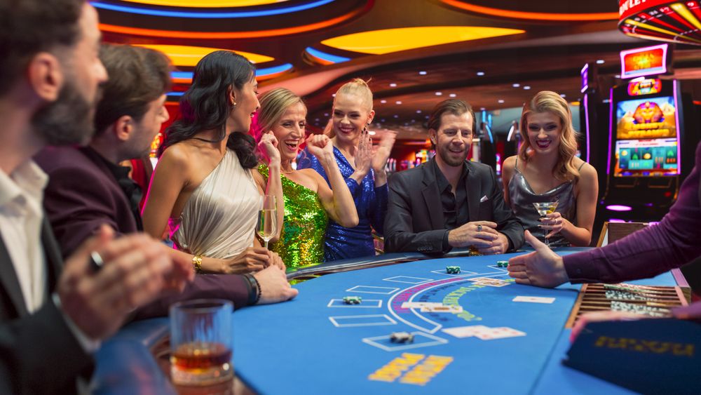 Diverse Group of Glamorous People Playing Game of Blackjack at Stylish Casino.