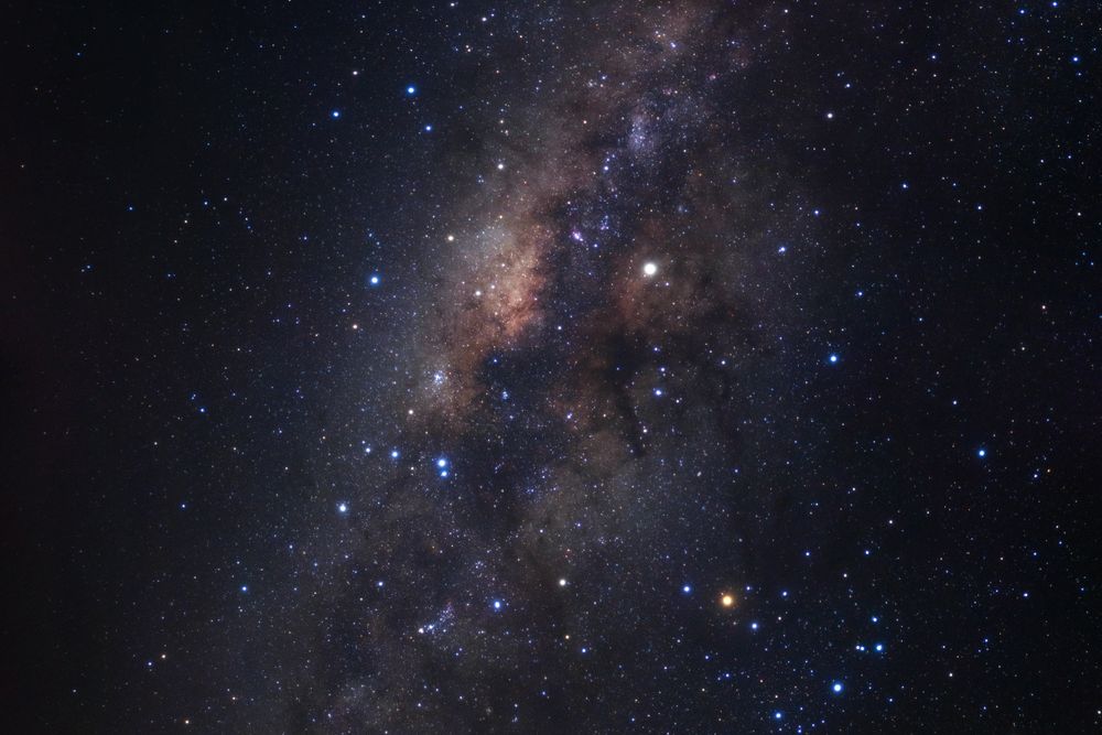 Milky way galaxy with stars and space dust in the universe, Long exposure photograph, with grain.