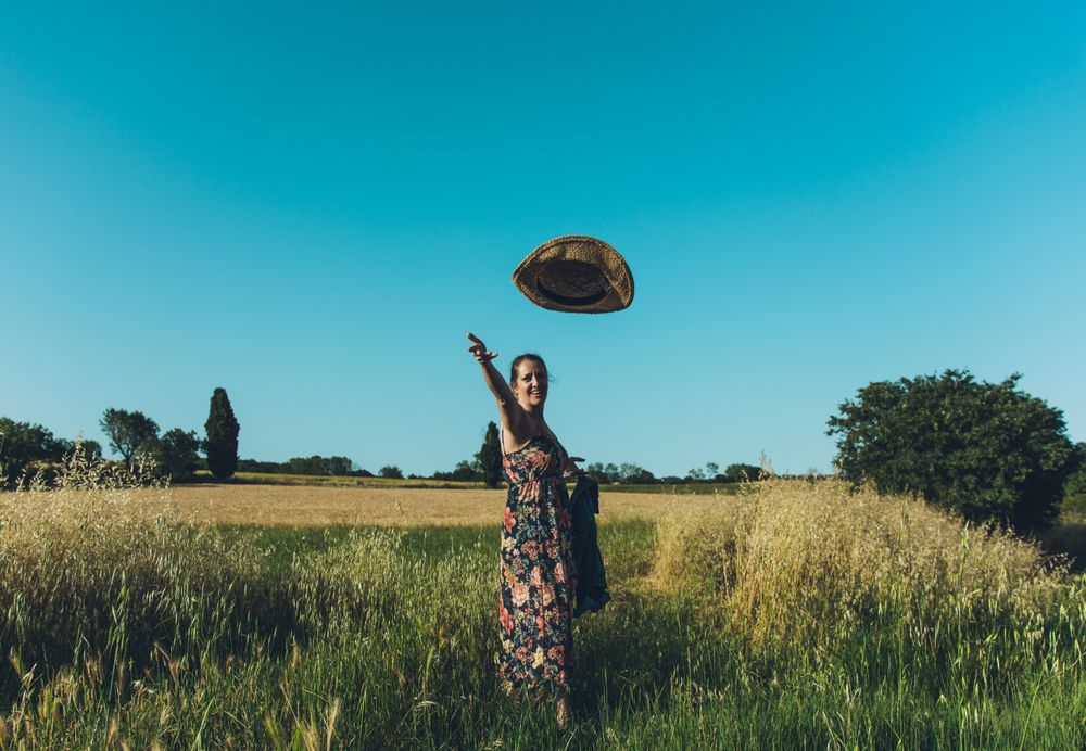 Female farmer with hat looking at camera