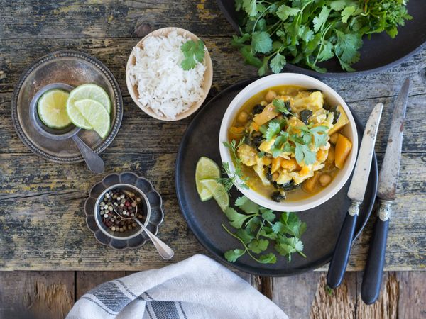 Plate with vegetarian curry on tray