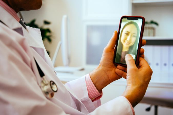 Happy patient on video call with doctor