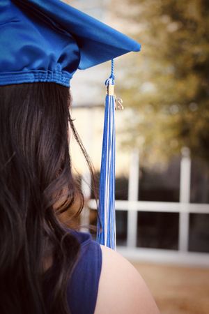 Woman wearing blue academic hat