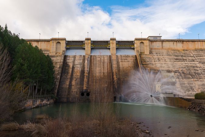 Concrete hydroelectric power station in sunlight