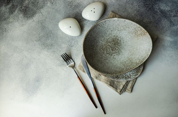 Grey plate with with salt & pepper shakers