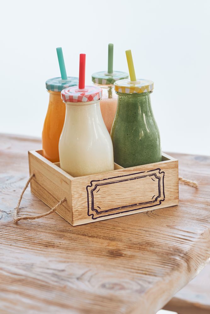 Set of assorted smoothies in wooden box