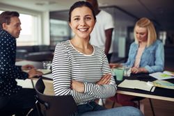 Portrait of smiling businesswoman in a casual office