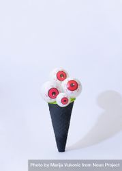Eyeballs in dark ice cream cone in halloween concept 481pjb